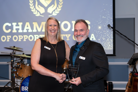 2026 Champions of Opportunity Gala, Executive Dir. Kristen Lafferty presented the award, which Parks and Recreation Dir. Steve Lackey accepted on behalf of the City. (Photo/City of Kissimmee)