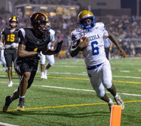 Osceola's Zylin Garrett. shown in last week's game against St. Cloud, scored in a wild sequence of the second quarter Friday to help the Kowboys take a 28-0 halftime lead en route to a 34-7 win over Poinciana. (Photo/Taylor McFee)