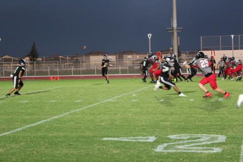 Nova Lakes QB Josh Rodriguez hits a Jaden Dionisi on a swing pass on the Rattlers' first possession Friday against Palm Bay. (Photo/Ken Jackson)