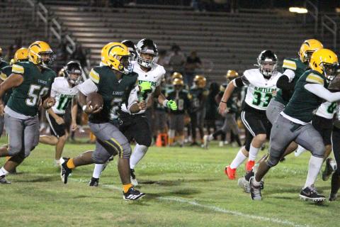 Liberty’s Ayomide Akinwole, shown here in last week's game against Nova Lakes, scored the Chargers' first points of 2026 with on a 10-yard run against Discovery Friday. (Photo/Michelle Kostuch)