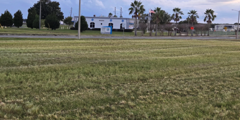 City leaders held a groundbreaking ceremony on July 8, 2025 for a 122-room Hyatt Studio Hotel on this plot of land across Martin Luther King Boulevard from the Kissimmee Gateway Airport administration building. Despite developer KPDM officials saying it could deliver the project by sometime in 2027, no work has occurred since then, or as of Wednesday, Sept. 30, when this photo was taken. (Photo/Ken Jackson)