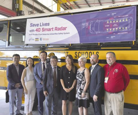 Representatives from Osceola County and Smart Radar System unveil the new bus technology. PHOTO/DEBBIE DANIEL