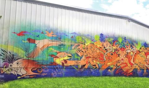 Veteran painter Joe Starkweather completed this 65-foot long mural at Skate Reflections on Dyer Boulevard earlier this month. PHOTO/KEN JACKSON