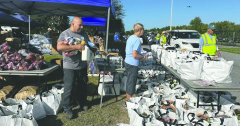Commissioner Brandon Arrington hosted his second annual Holiday Food Distribution event at St. Rose of Lima Church in Kissimmee Saturday, providing 600 families with the basics of a holiday meal. (Photo/Osceola County)