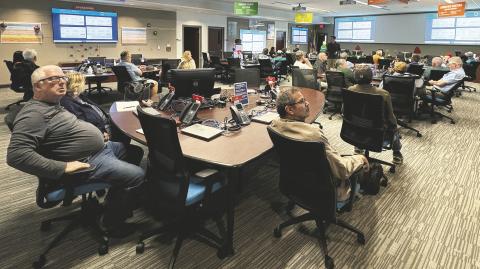 Will Ulrich, center, a meteorologist with the National Weather Service Melbourne, trains volunteer weather spotters at the Osceola County Emergency Operation Center on Tuesday, Dec. 9 (Photo/Terry Lloyd).