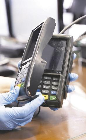 Look for anything loose, crooked, damaged, or scratched, or a mismatched color from its base at a card reader—it may be a skimmer. (Photo/U.S. Secret Service)