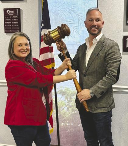 The Osceola Chamber Chairman Tim Weisheyer has ceremoniously passed the gavel to 2026 Chairwoman Rebekah Hurd, who will assume the role officially on Jan. 1. (Photo/The Osceola Chamber)