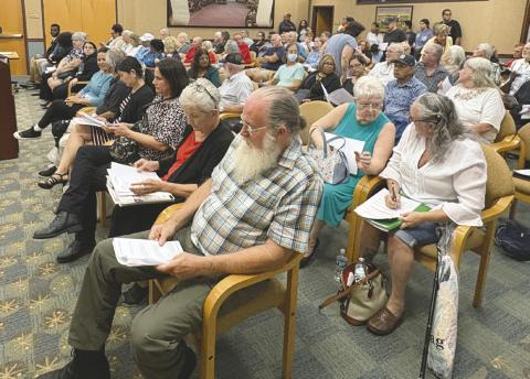 The Aug. 19 Planning Commission meeting drew a capacity crowd—and overflow attendees who had to watch from the large “Bridge” breakroom television (Photo/Terry Lloyd)