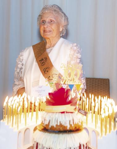 Kissimmee resident Noella Chalifoux celebrated her 100th birthday with family and friends—and 100 candles on her birthday cake. (Photo/Jennifer Chalifoux)