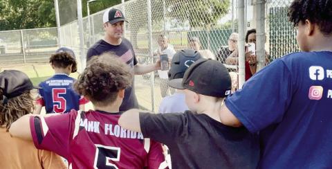 Coach Josh White’s cousin, Arizona Diamondbacks pitcher Merrill Kelly, shared some advice with local Little League players Sunday, encouraging them to work as a team. PHOTO/DEBBIE DANIEL