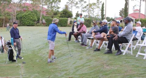 Royal St. Cloud Golf Links Head Professional Doug Holloway works with veterans during a recent session of the Helping Our Patriots Everywhere (HOPE) golf clinic. PHOTO/TERRY LLOYD