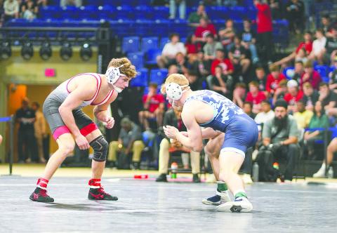 Anderson Heap (left), a three-time state champion competing for Davidson, won the Southern Conference Tournament and will become the sixth Osceola High alum to compete at the NCAA national tournament. (Photo/Davidson SID)