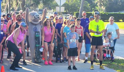 Marley the Manatee gets runners ready to start the Drowning Awareness 5K Run. PHOTO/KEN JACKSON